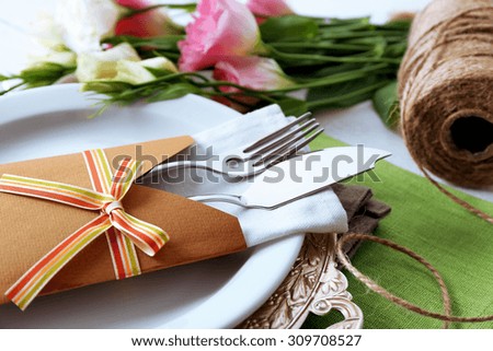 Table setting with spring flowers, close-up
