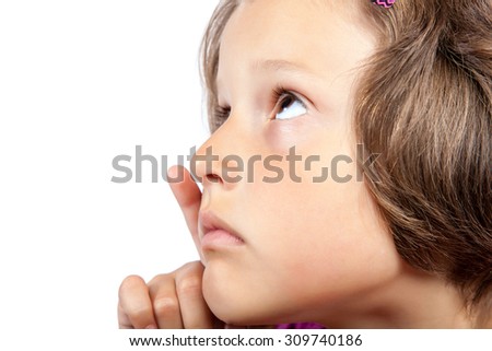 Little pretty girl with a pensive look isolated on white background.