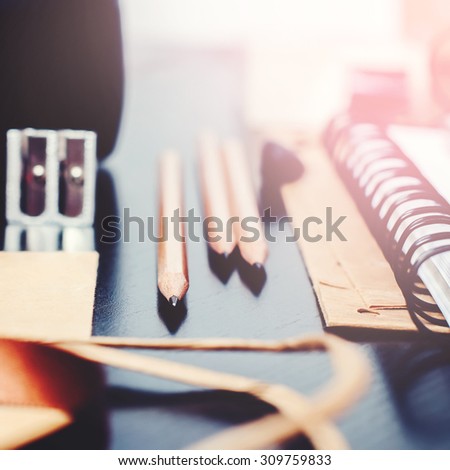 Office Accessories, Pencils and other things on Black Table, selective focus, toned