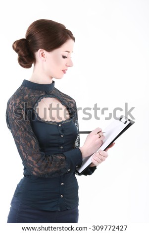 Happy young businesswoman writing on blank paper on clipboard on white background