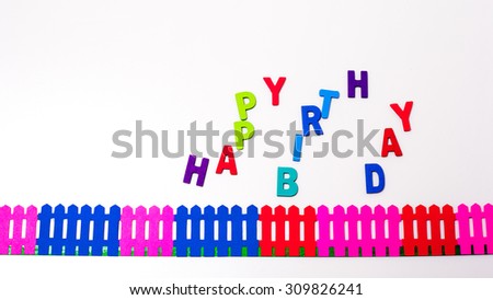 "HAPPY BIRTHDAY" woods colorful  made by wooden letters on white background.