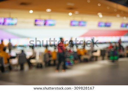 Blurred image of people at bowling arena