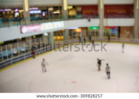 Blurred image of ice skating arena in shopping mall