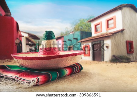 Mexican hat "sombrero" on a "serape" in a mexican town