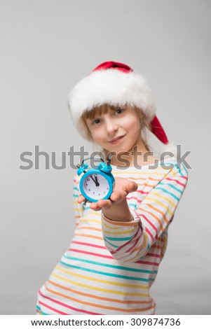 Little girl with a clock