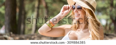 Panoramic picture of a beautiful girl enjoying sun