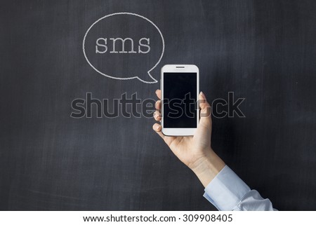 SMS concept on blackboard