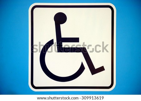 Blue rectangle handicapped sign with wheelchair, isolated on white,