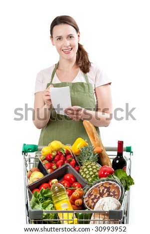 A woman in a store assistant role with a list on a white background and a cart full of fresh goods. Royalty-Free Stock Photo #30993952