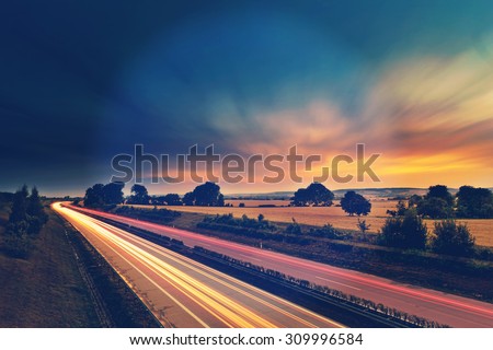 Long-exposure sunset over a highway with instagram vintage old effect