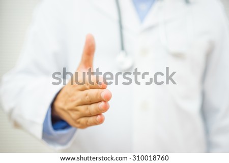 doctor is offering a hand to patient for partnership