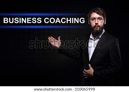 Businessman over black background presenting Business coaching