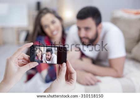 Hands talking photo of beautiful couple with smartphone