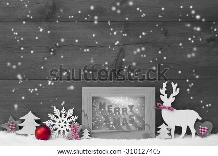 Black And White Christmas Decoration With Reindeer Christmas Trees Snowflakes Red Ball On Snow. Picture Frame With English Text Merry Xmas. Christmas Card For Seasons Greetings. Wooden Background