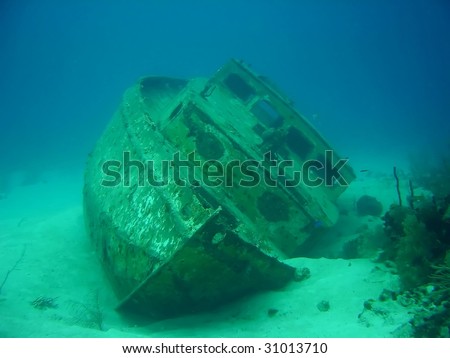 A shipwreck laying in the bottom of the sea Royalty-Free Stock Photo #31013710