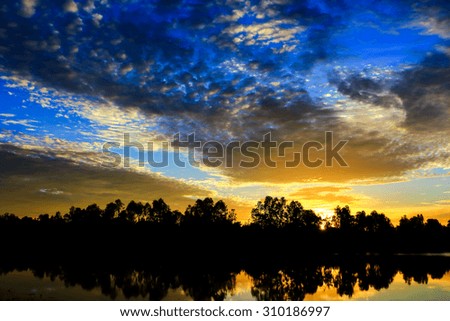 Sunset  sunrise with clouds, light rays and other atmospheric effect