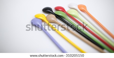 Multi-colored spoon Brown, purple, yellow, green, red,white, 