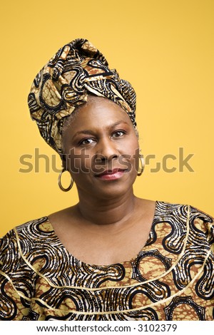 African American mature adult female dressed in African costume.