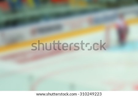 Abstract blur of ice hockey players at tournament play. Bokeh background