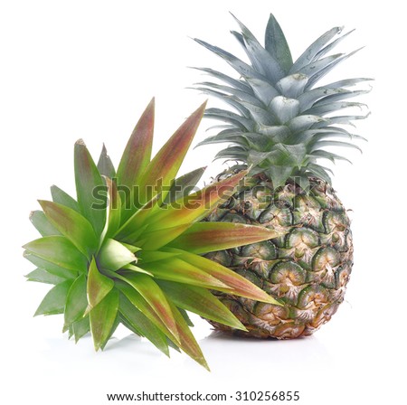 Pineapple and pineapples leaves isolated on white background.