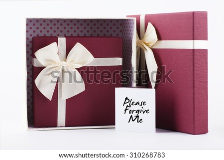 Two open gift box with yellow ribbon with red heart shape gift box inside with "Please Forgive Me Day" words on white card - anniversary, valentine, birthday and couple concept