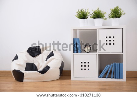 Picture of shelving unit and new sit in teenager room