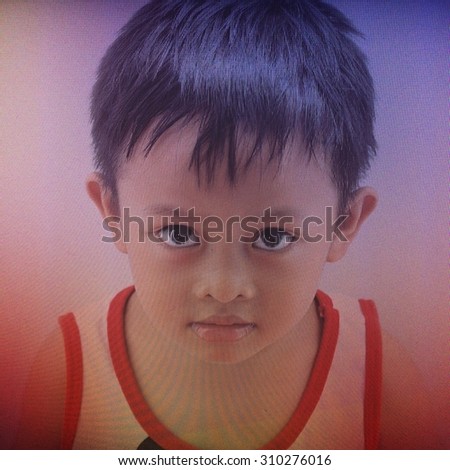 Asian boy on LED screen - double exposure style