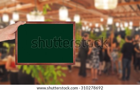Chalkboard with blur night bar background