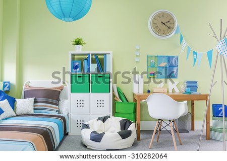 Picture of teenage boy room interior with stylish furniture