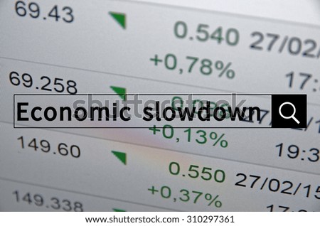 Economy slowdown written in search bar with the financial data visible in the background. Multiple exposure photo.