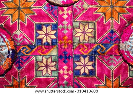Colorful thai handcraft peruvian style rug surface close up. More of this motif & more textiles peruvian stripe beautiful background tapestry persian nomad detail pattern arabic fashionable textile. Royalty-Free Stock Photo #310410608