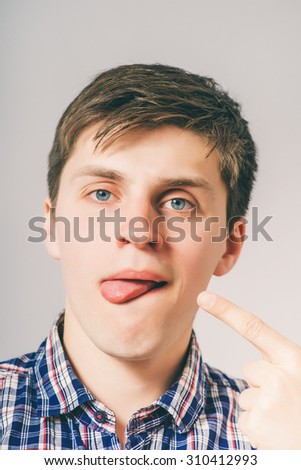 man shows on the tongue