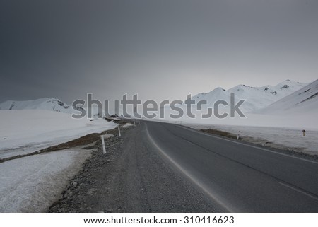 Georgian military high alpine road on the mountain pass between Gudauri and Stepansminda, Kazbegi, Caucasus, Georgia