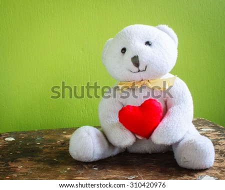 teddy bear with red heart romantic background
