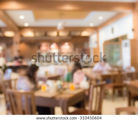 blur people  sitting on seat in dining room with bokeh