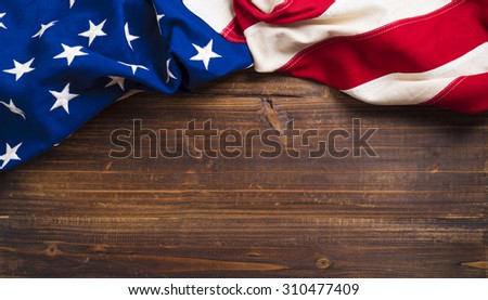 An old american flag on a antique wooden platform with copy space