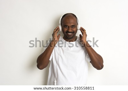 casual african listening to music