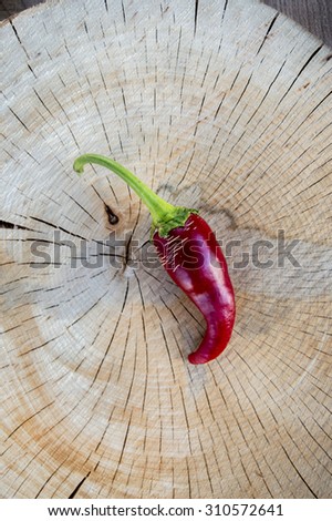 Pepper on cracked wood