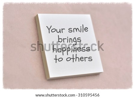 Text your smile brings happiness to others on the short note texture background