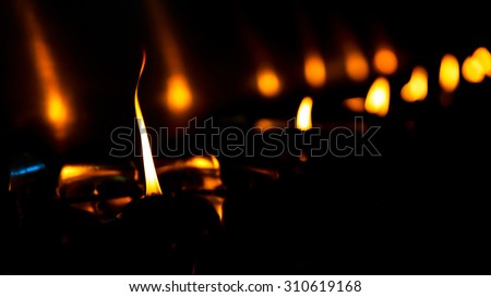 candlelight on black background for important day in buddhism or occasions