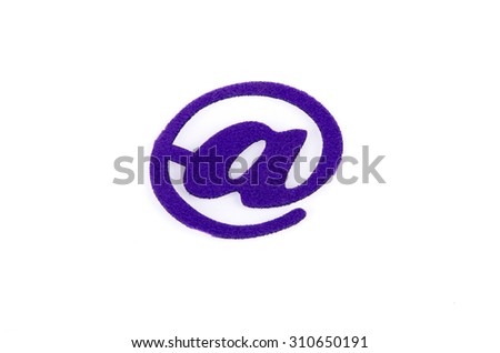 Email symbol made from carpet fabric over white background