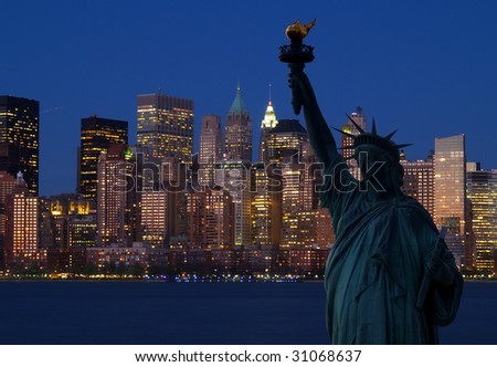 The Statue of Liberty and Manhattan Skyline at dark