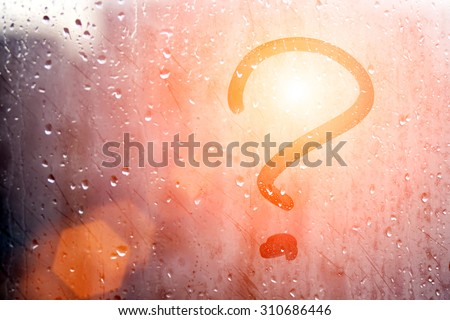 Autumn rain, the inscription on the sweaty glass - question mark Royalty-Free Stock Photo #310686446