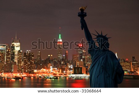 The Statue of Liberty and Manhattan Skyline at dark