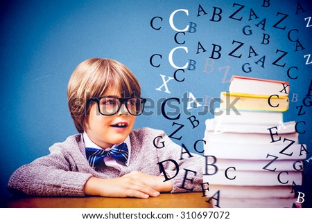 Cute pupil with pile of books against blue background