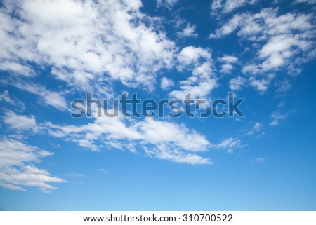 Altocumulus, bright blue sky with middle type of clouds, natural background photo
