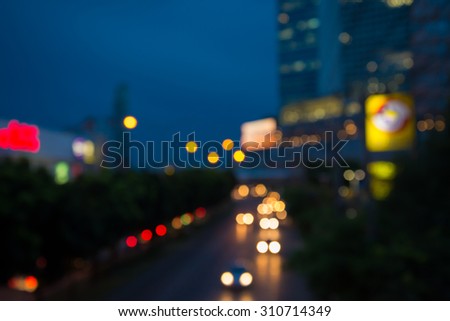 The evening twilight traffic in Bangkok city lights motion blur