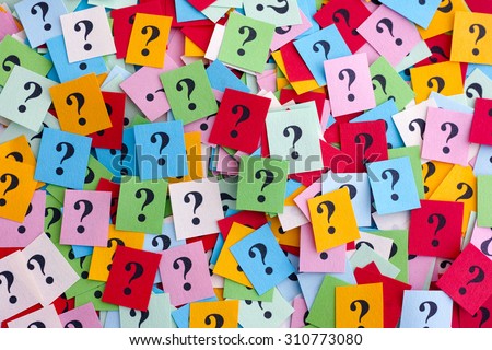 Too Many Questions. Pile of colorful paper notes with question marks. Closeup. Royalty-Free Stock Photo #310773080