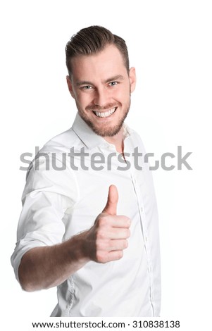 An attractive man standing in a studio with white background, wearing a white shirt. Feeling great!