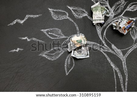 Money tree drawing on blackboard close up